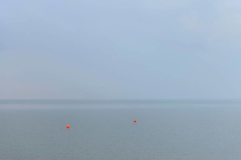 North Sea, two red buoys in the Wadden Sea, Norddeich, Lower Saxony, Germany
