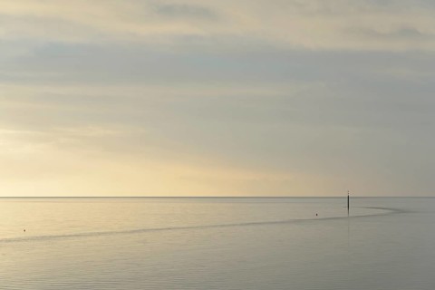 Wadden Sea at rising water, stone groyne with sea mark, North Sea, Norddeich, Lower Saxony, Germany