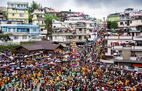 People from the Pnar community march in a circle around a Rot as they celebrate an event organised