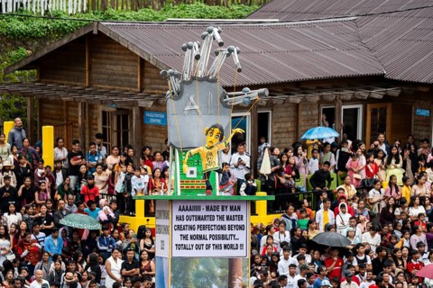 People from the Pnar community move around a Rot themed AI technology as they celebrate an event