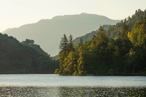 Sunrise in summer at Lake Thumsee near Bad Reichenhall. With a view of the Karlstein castle ruins