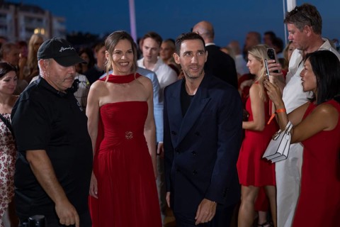Hilary Swank and Marcel Remus walk through the crowd at the Remus Lifestyle Night on the rooftop