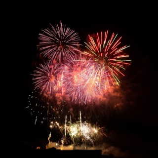 Colorful fireworks burst across the night sky in France, marking the celebration of Bastille Day on