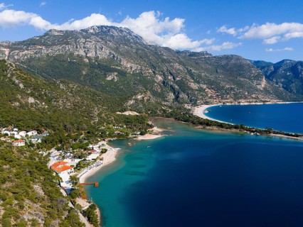 A picturesque coastal landscape with blue sea, beach and majestic mountains, Fethiye, Mugla, Mugla,