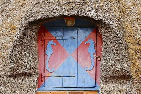 Thatched roof and window with shutters, St. Peter-Ording, Eiderstedt peninsula, North Frisia,