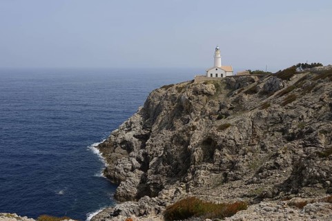 Rocky coast and Far de Capdepera lighthouse, Punta de Capdepera, Cala Rajada, Majorca, Balearic