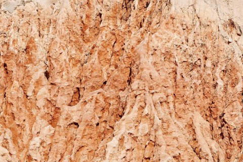 Eroded sandstone cliffs on the coast, Algarve, Portugal