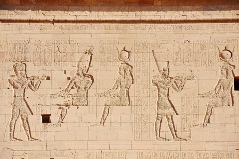 Relief of the king in front of the gods Osiris-Onophris and Isis and the king in front of the gods