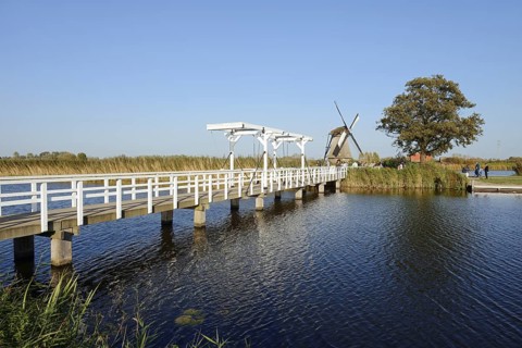 Historic windmill and drawbridge, UNESCO World Heritage Site, Kinderdijk, South Holland,