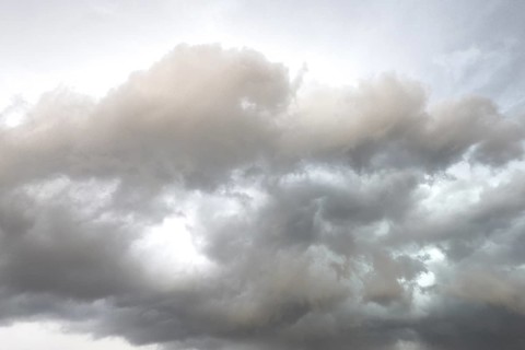 Dark discoloured storm clouds Cloud roll above grey clouds Rain clouds herald thunderstorms,