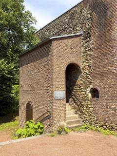 Stenshofturm, so-called Romanesque house made of sandstone from the 12th century in a model garden