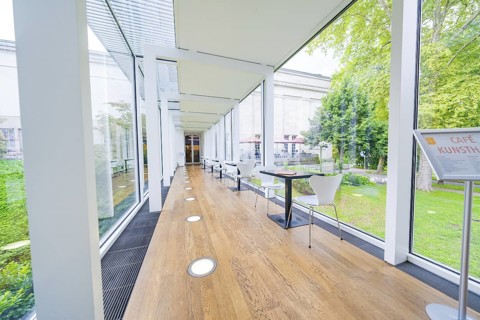 A modern café with glass walls and garden views, bright and open, Frieder Burda Museum, Baden