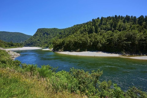 River in the middle of forests with blue sky and mountains in the background, Kilkenny Lookout,