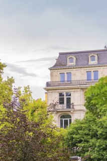 Classic building with richly decorated façade and windows, surrounded by trees, Baden Baden,