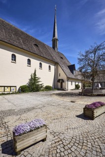 Parish church Bayerisch Gmain, church, square, paving stones, flower pots, garden pansies (Viola