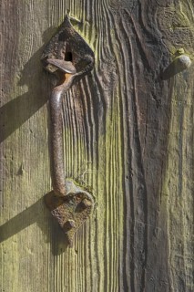 Old wooden door with iron fittings, Münsterland, North Rhine-Westphalia, Germany