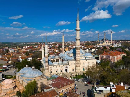 Impressive mosque with slender minarets surrounded by a city, aerial view, Mosque, Üç-Serefeli