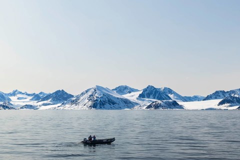Zodiac in front of glacier, mountain range, snow, sea, Smeerenburg, Spitsbergen, Svalbard