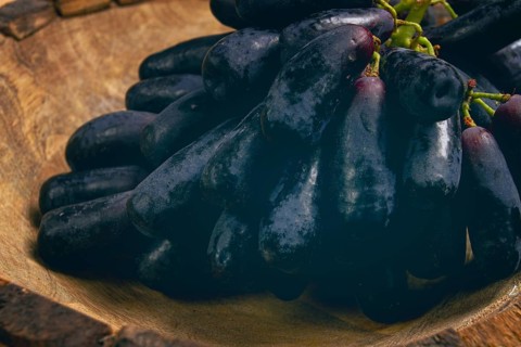 Bunch of black grapes, kishmish variety, black finger, ophelia, Annushka