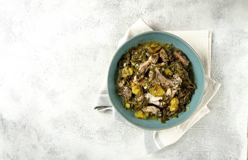 Chakapuli, Georgian dish, stewed meat with herbs and tkemali, in white wine, homemade, no people