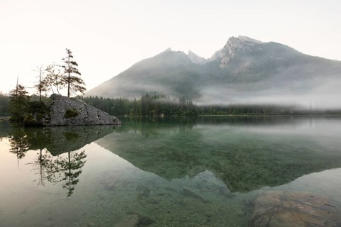 Magical sunrise with fog at Hintersee near Ramsau in Berchtesgadener Land