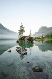 Magical summer sunrise with fog at Hintersee near Ramsau in Berchtesgadener Land