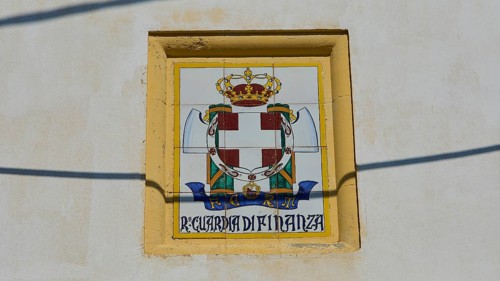 Guardia di Finanza, Coat of arms with crown and shield on beige background, textual elements,