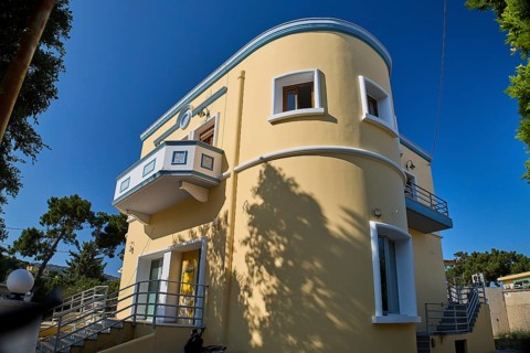 Modern yellow house with curves and balcony surrounded by trees, Armando Bernabiti, Historicism,