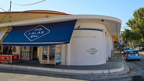 Fish market, A shop with a blue canopy on a street corner, Modern architecture, Armando Bernabiti,