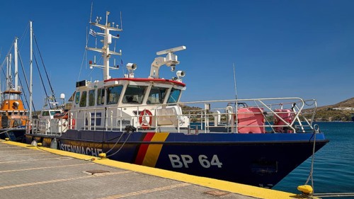 Large patrol boat at the dock in a harbour under a clear blue sky, Frontex. German Coast Guard,