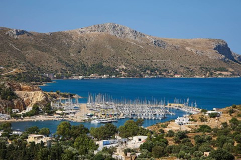 Panoramic view of a harbour full of sailing ships on a picturesque coastal landscape, Lakki, Leros,