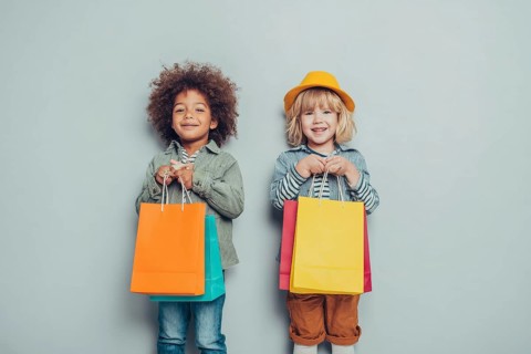 Children with colourful shopping bggs, AI generated
