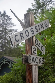Clover Lick, West Virginia - An old railroad crossing sign stands next to the Greenbrier River