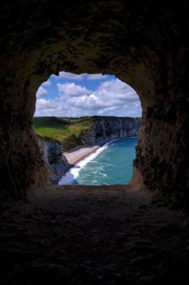 View through the eye of the panda, L'oeil du Panda, rock window, cave, in the rock arch Falaise