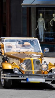 Prague, Old city center, tourism tours and sightseeing in old retro vintage cars