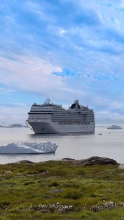 Iceberg seen from cruise ship vacation near Greenland coast in Arctic circle near Ilulissat Disko