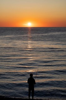 Angler fishing, silhouette, Étretat, sea, sunset, evening mood, atmospheric, Normandy,