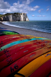 Kayaks, boats, colourful, lying on the beach, pebble beach, rock arch Falaise or Porte d'Aval,