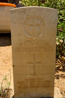 Gravestone of a soldier with cross and inscription in warm light, Hugh Gore-Booth, Irishman,