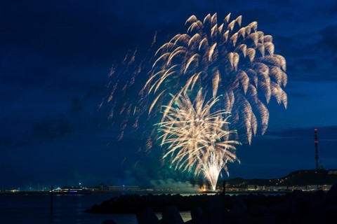 Radiant luminous colours, atmospheric fireworks in green and gold, Heligoland island festival,