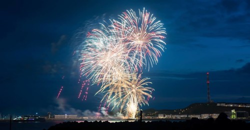 Bright illuminated colours, atmospheric fireworks in red, green and gold, Heligoland island