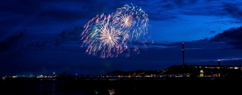 Radiant luminous colours, atmospheric fireworks in red, green and gold, Heligoland island festival,