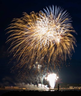 Colourful fireworks, many, radiant illuminated sheaves, atmospheric fireworks in white and gold,