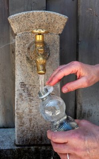 Drinking water supply at a public well, Bavaria, Germany