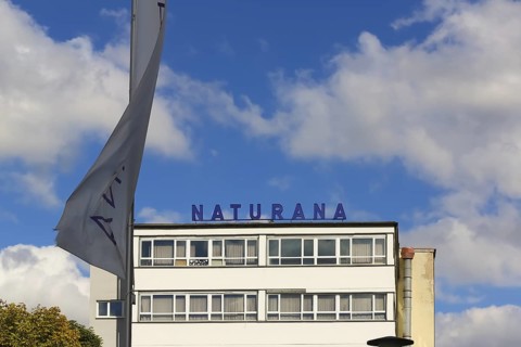 Naturana Miederfabriken, company building of Naturana Dölker Textilbekleidung, lettering, flag,