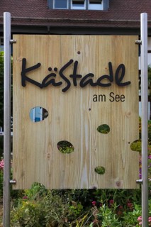 Wooden sign KäStadel am See, Kässtadel, specialist cheese shop with bistro, cheese shop,