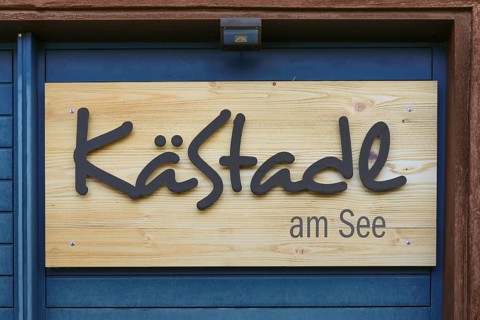 Wooden sign KäStadel am See, Kässtadel, specialist cheese shop with bistro, cheese shop,