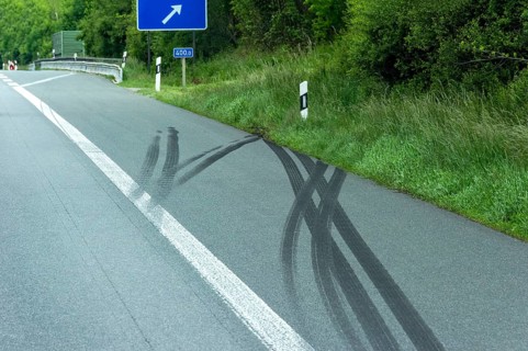 Accident scene, heavy skid marks on the hard shoulder into the embankment after an accident, A9