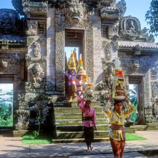 Temple festival, woman wearing traditional costumes, Gebogan, offerings piled up up to pyramids,
