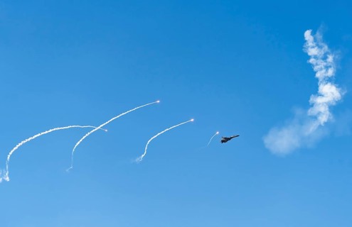 The Indian Air Force aerobatic team performs during an air show as part of the 93rd Air Force Day